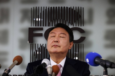 Yoon Suk-yeol, then the 2022 presidential election candidate of South Korea's main opposition People Power Party, attends a news conference in Seoul in November 2021.   