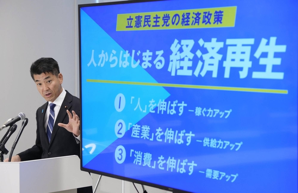 Constitutional Democratic Party of Japan leader Kenta Izumi attends a news conference to announce the party's new economic policy on Friday.