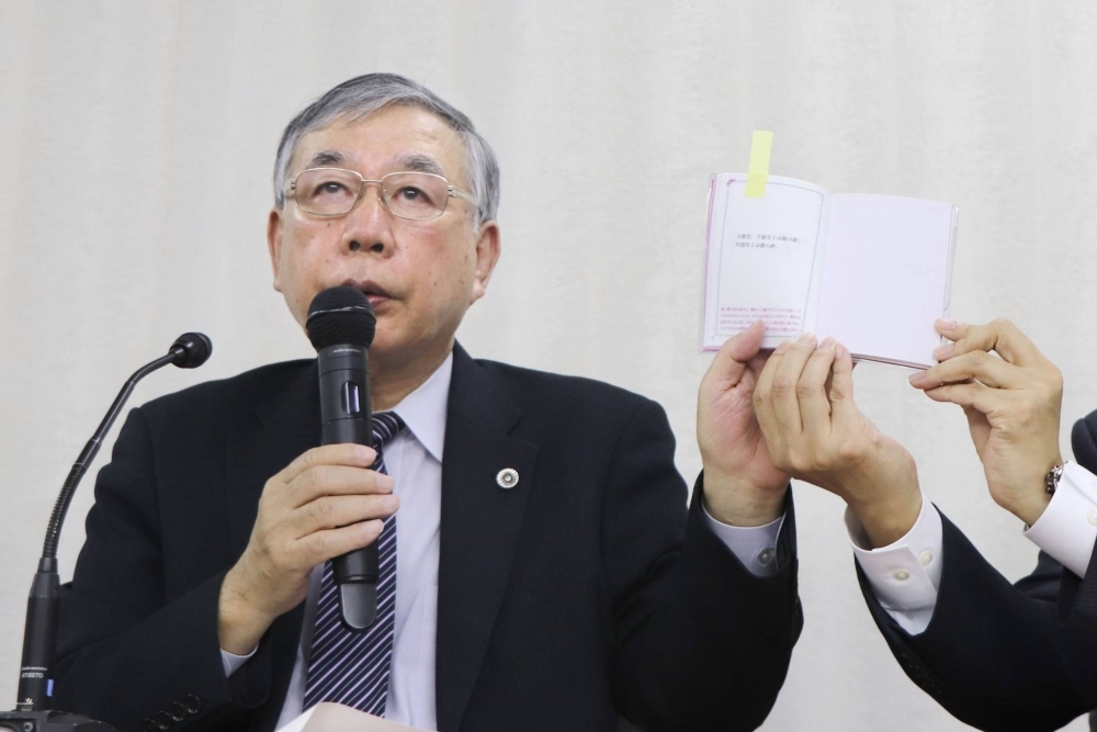 Hiroshi Kawahito, a lawyer representing the bereaved family of a 25-year-old actress who was with the Takarazuka Revue theater company, speaks during a news conference on Friday in Tokyo.