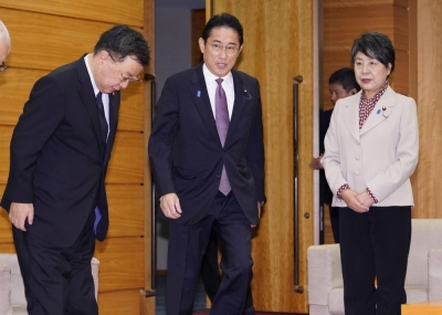 Prime Minister Fumio Kishida arrives for a Cabinet meeting at the Prime Minister's Office in Tokyo on Friday.