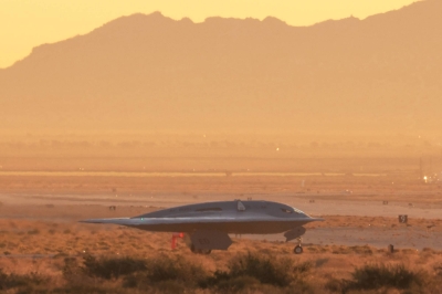 The United States Air Force's B-21 Raider, the long-range stealth bomber that can be armed with nuclear weapons, rolls onto the runway at Northrop Grumman's site at Air Force Plant 42, during its first flight, in Palmdale, California, on Friday.