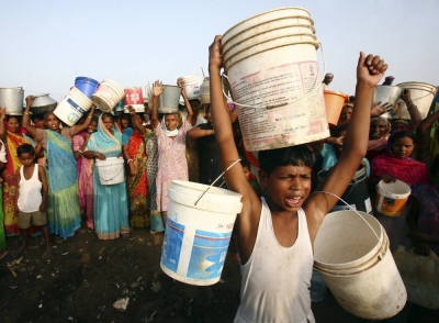 Slum dwellers shout slogans as they carry empty containers during a protest over water scarcity in the northern Indian city of Chandigarh in 2009. 