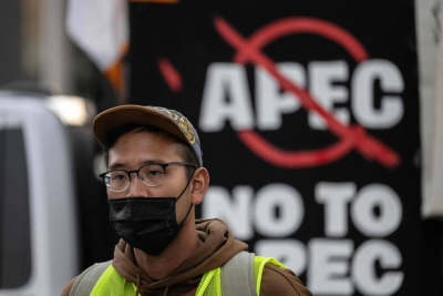 A protester looks on during a protest on the sidelines of the Asia-Pacific Economic Cooperation Leaders' Meeting in San Francisco on Sunday.