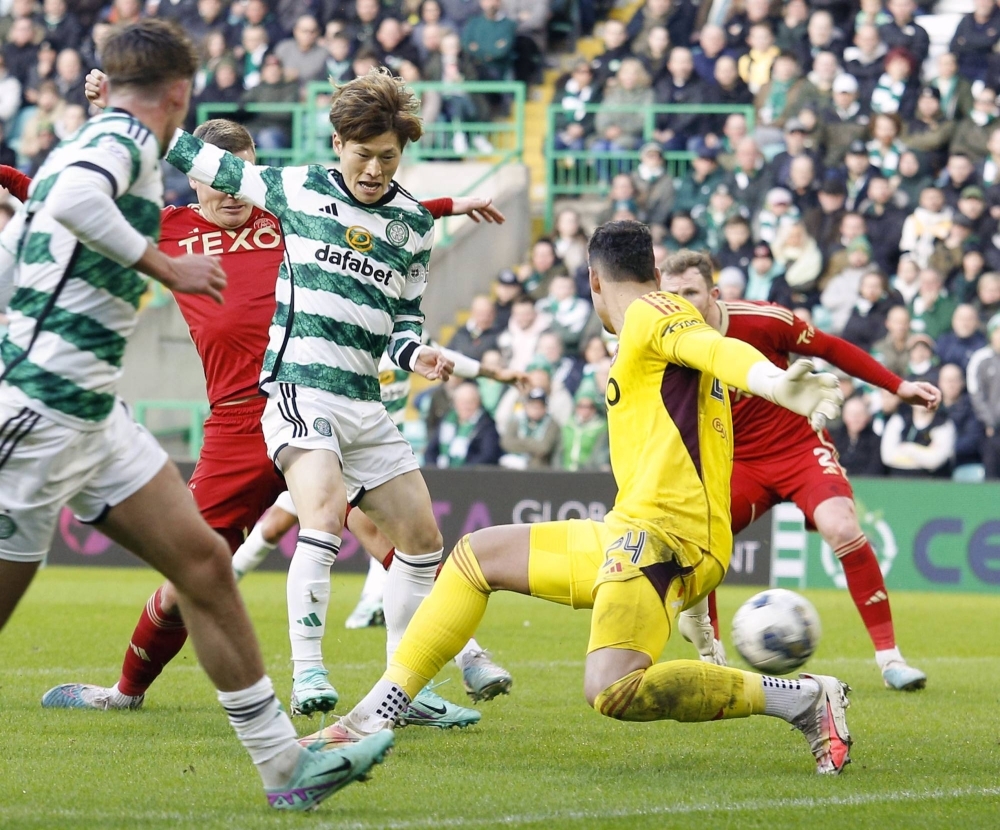 Celtic's Kyogo Furuhashi (center) scored against Aberdeen in Glasgow, Scotland, on Sunday before leaving the match with an injury.