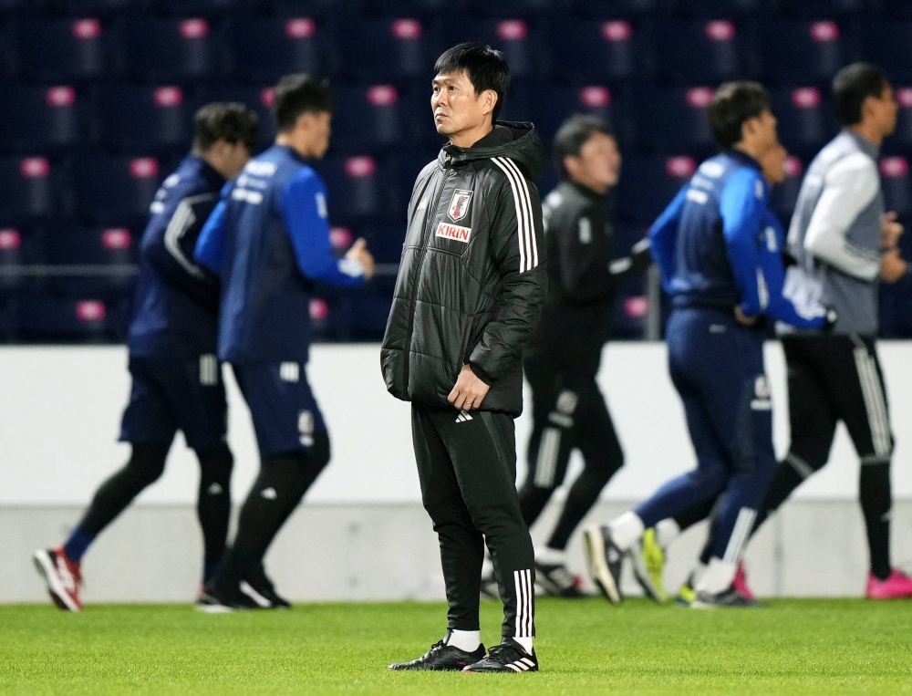 Japan national team manager Hajime Moriyasu watches his players train in Osaka on Monday ahead of their upcoming World Cup qualifier at home to Myanmar.