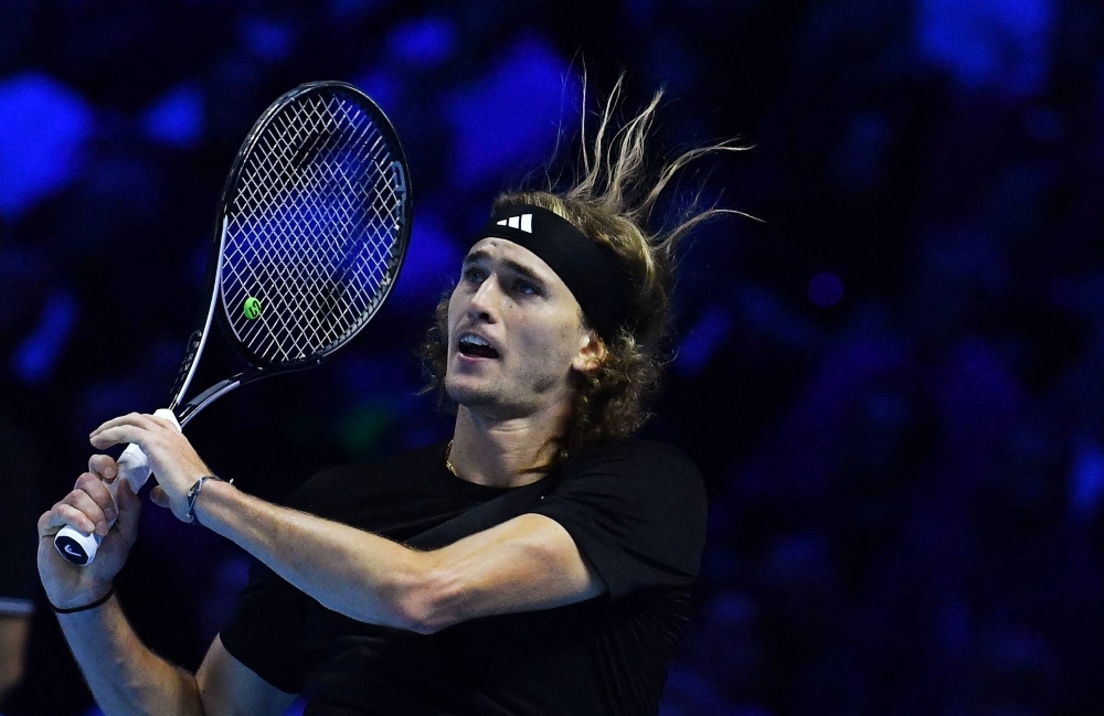 Germany's Alexander Zverev returns to Spain's Carlos Alcaraz during their first round-robin match at the ATP Finals tennis tournament in Turin on Monday.
