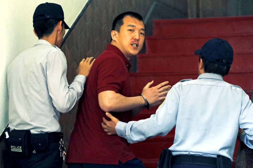 Mainland Chinese student Zhou Hongxu arrives for a court hearing on suspicion that he attempted to develop a spy network for China in Taiwan in March 2018.  