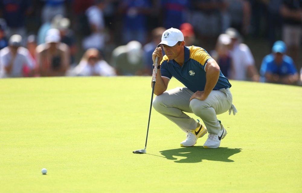 Rory McIlroy lines up his putt during the Ryder Cup in Rome on Oct. 1. The popular golfer has made no secret that the PGA Tour's secret talks with Saudi Arabia had blindsided and stung him.