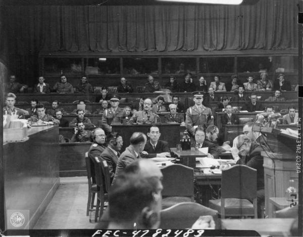 Trial participants listen to wartime leader Hideki Tojo give his defiant testimony in the old Army Ministry courtroom during the International Military Tribunal for the Far East in January 1948.