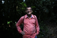 Jorge Santofimio, environmentalist and former guerrilla and signatory of the peace agreement between the Revolutionary Armed Forces of Colombia (FARC) and the Colombian government, poses for a photo during a day of searching for seeds to reforest the jungles, in Puerto Guzman, Colombia, in February 2022. | REUTERS