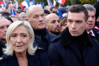 Rassemblement National member of Parliament Marine Le Pen (left), and the president of the far-right party Jordan Bardella (right) march during a demonstration against antisemitism in Paris on Sunday