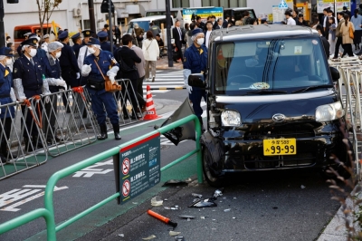 The scene after a car crashed into a barricade near the Israeli Embassy in Tokyo on Thursday