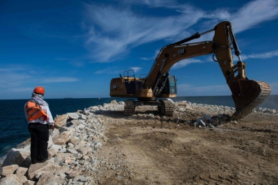 A worker supervises construction work on a wave breaker in the port of Salina Cruz, Oaxaca, Mexico, on Oct. 9, as part of expansion works on the Interoceanic Railway that connects the Pacific Ocean and the Gulf of Mexico.