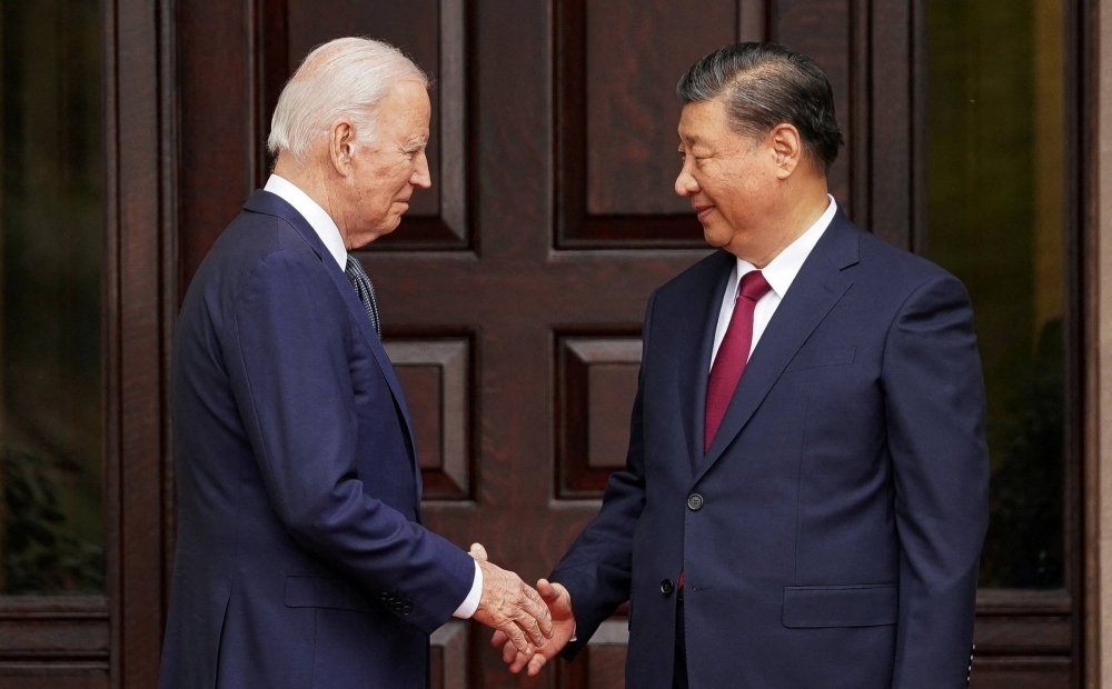 U.S. President Joe Biden greets Chinese President Xi Jinping on the sidelines of an Asia-Pacific Economic Cooperation summit in Woodside, California, on Nov. 15.