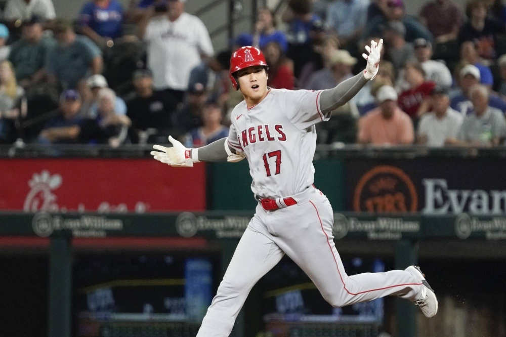Angels designated hitter Shohei Ohtani rounds the bases after a go-ahead, two-run home run against the Rangers in Arlington, Texas, on June 12.