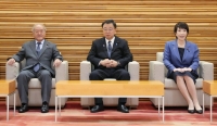 Ministers gather for a Cabinet meeting on Friday at Prime Minister's Office.  | KYODO