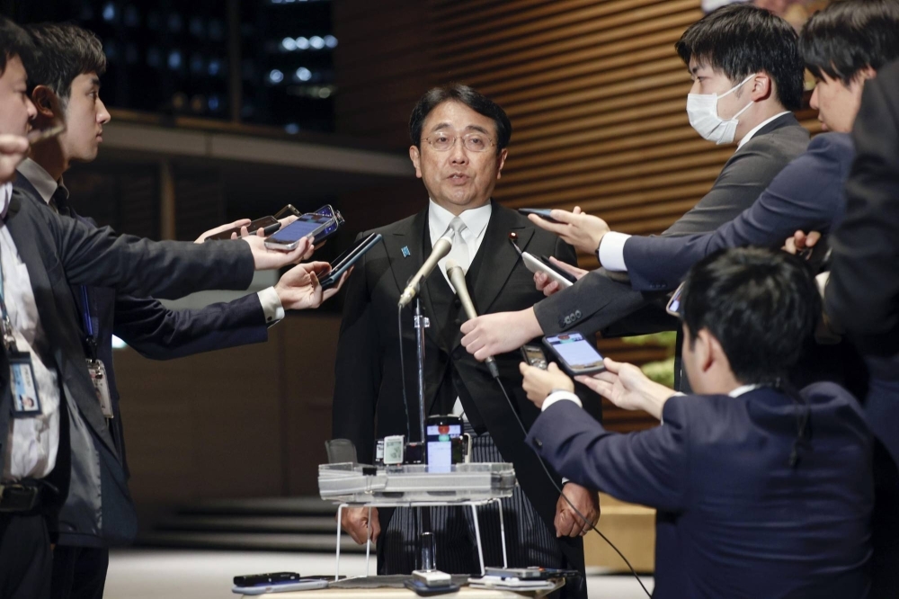Deputy Finance Minister Ryosei Akazawa speaks to reporters on Monday.