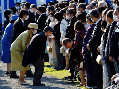Emperor Naruhito and Empress Masako greet guests during the autumn garden party at the Akasaka Palace in Tokyo on Nov. 2. 