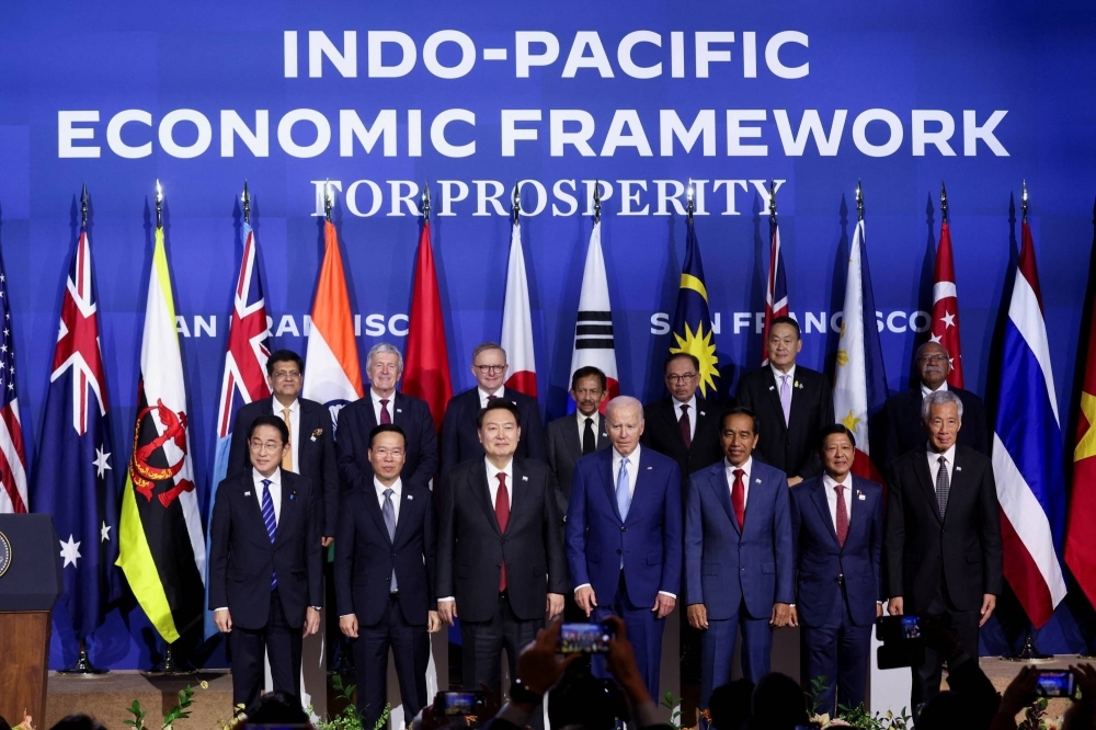 Indo-Pacific Economic Framework leaders pose for a family photo at the Asia-Pacific Economic Cooperation summit in San Francisco on Thursday.