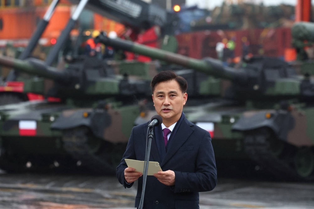 Eom Dong-hwan, South Korea's minister for its defense acquisition program and administration, speaks at a ceremony marking Poland's receiving of its first delivery of South Korean K2 Black Panther tanks and K9 self-propelled howitzers in Gdynia, Poland, in December 2022.