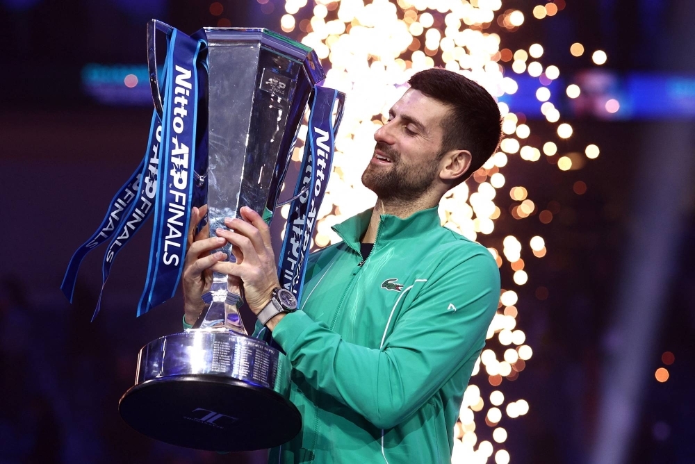 Novak Djokovic celebrates after winning the ATP Finals in Turin, Italy, on Sunday.