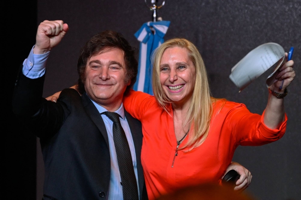 Javier Milei (left) celebrates with his sister Karina Milei after winning the presidential election runoff at his party headquarters in Buenos Aires on Sunday.