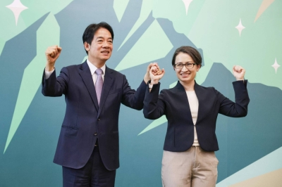 Taiwanese Vice President Lai Ching-te (left), presidential candidate from the Democratic Progressive Party, introduces Hsiao Bi-khim, Taiwan's de facto envoy to the United States, as his running mate in the 2024 election, during a news conference at Lai's campaign headquarters in Taipei on Monday.