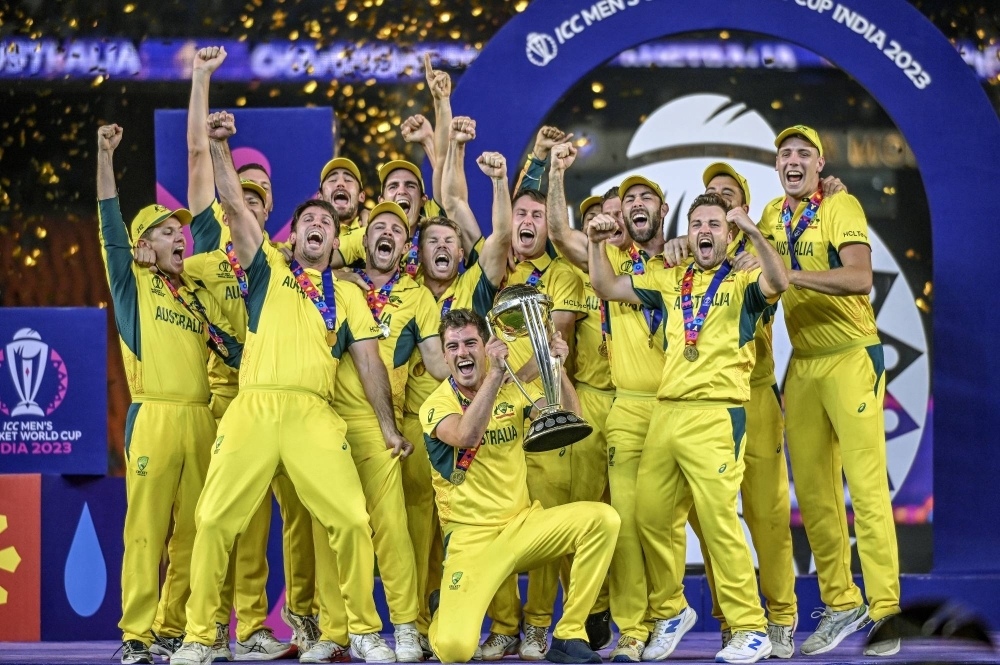 Members of the Australian national team celebrate after winning the Cricket World Cup final at Narendra Modi Stadium in Ahmedabad, India, on Sunday.