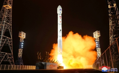 A North Korean rocket carrying a military spy satellite is launched in this undated photo released Wednesday.  