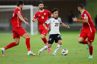 Takefusa Kubo looks to make a pass during Samurai Blue's World Cup qualifier against Syria in Jeddah, Saudi Arabia, on Tuesday. 