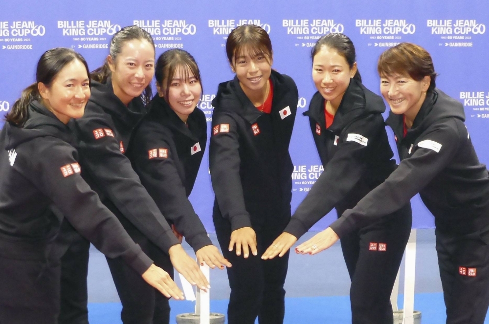 Japan captain Ai Sugiyama (right) poses with the team after a Billie Jean King Cup playoff against Colombia at Ariake Coliseum on Nov. 9.