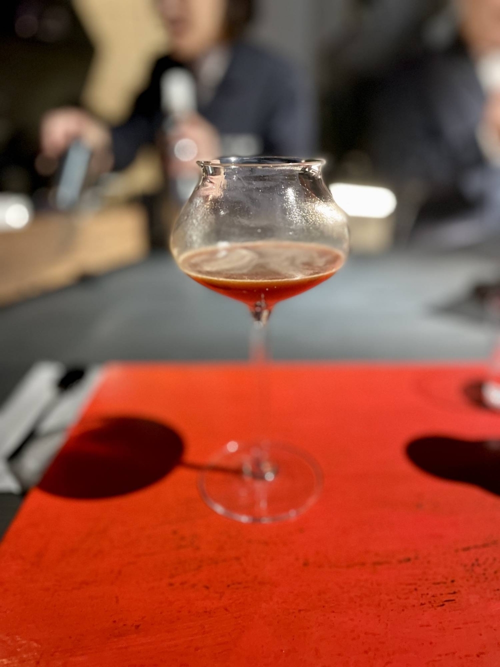 The last course is an espresso-based mocktail made with pomegranate concentrate, hibiscus cold brew and fermented white peach.