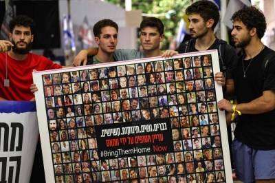 Relatives, friends and supporters of Israeli hostages held in Gaza since the Oct. 7 attack by Hamas militants in southern Israel hold placards and images of those taken, during a protest for their release in Tel Aviv on Wednesday.