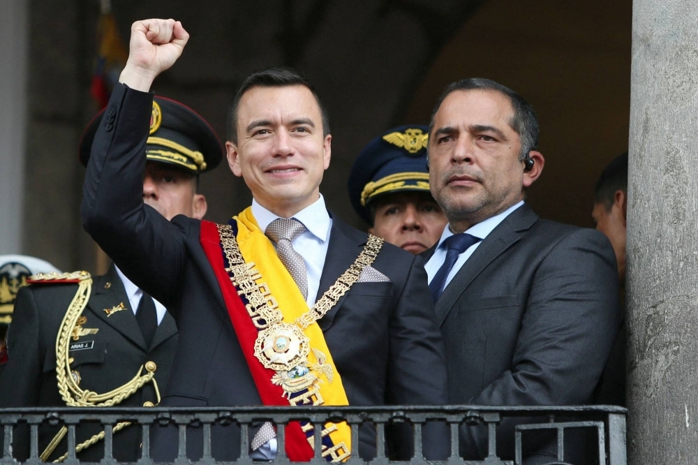 Ecuador's new President Daniel Noboa gestures to the crowd from the balcony of Carondelet Palace after being inaugurated at the National Assembly, in Quito, Ecuador, on Thursday.