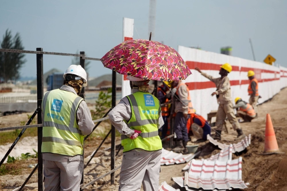 Construction workers at the Kalimantan Industrial Park Indonesia. 