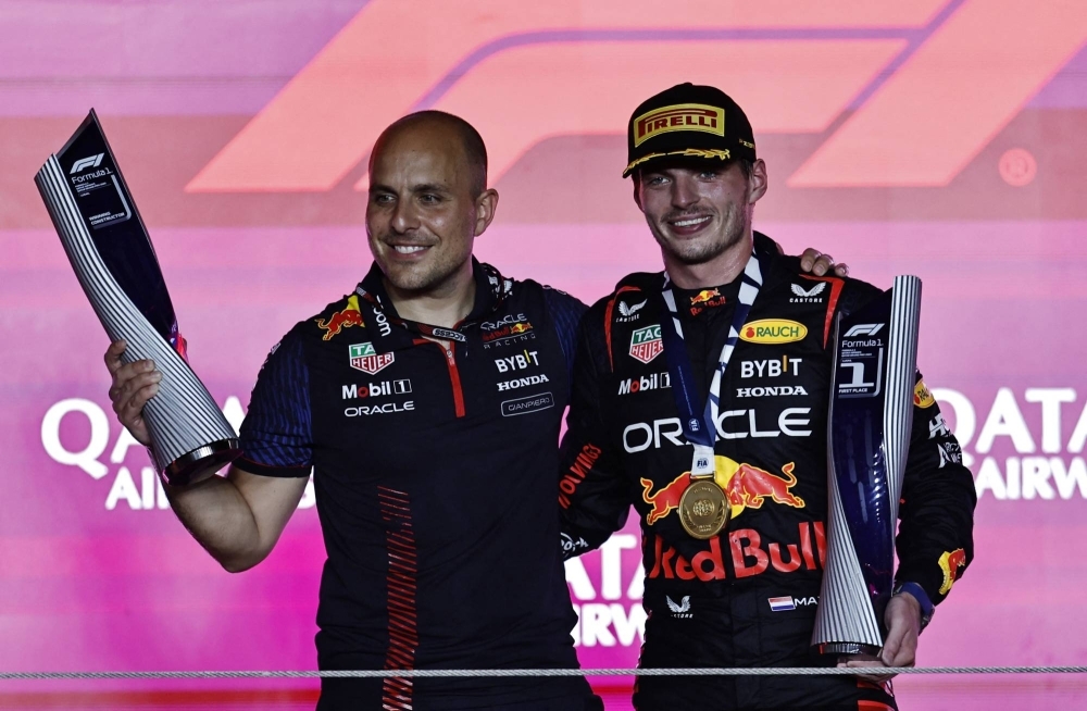 Red Bull driver Max Verstappen (right) celebrates with engineer Gianpiero Lambiase after winning the Qatar Grand Prix in Lusail, Qatar, on Oct. 8.