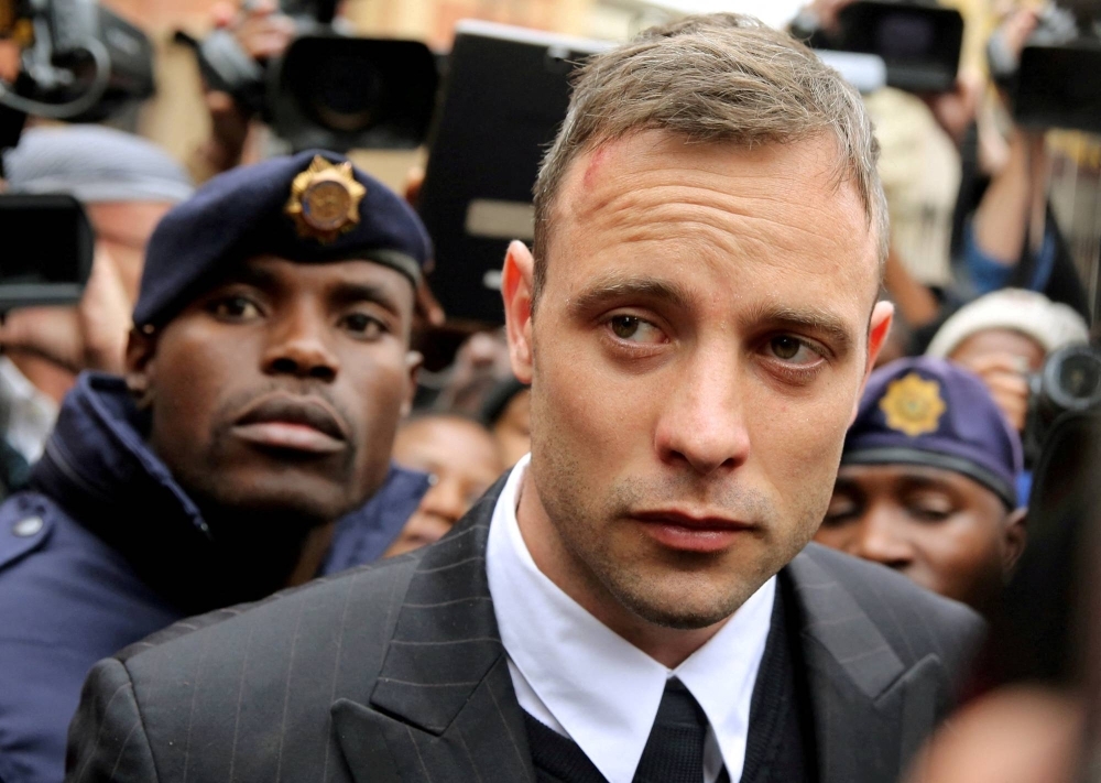 Olympic and Paralympic track star Oscar Pistorius leaves a courthouse in Pretoria, South Africa, in 2016. 