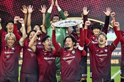 Vissel Kobe players celebrate the club's first top-flight J. League title on Saturday. 