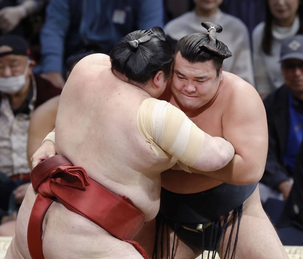 Kirishima (right) will take the solo lead into the final day of the Kyushu Grand Sumo Tournament after his win over Atamifuji (left) on Saturday in Fukuoka.  