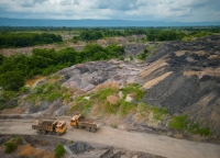 The slag heaps of the Yun Khean coal mine contrast with the surrounding pockets of farms and forest two kilometres from the Han Seng power plant in Cambodia’s Oddar Meanchey province.  | ANTON L. DELGADO
