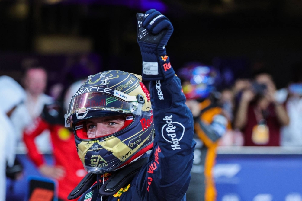 Red Bull's Max Verstappen greets the fans after he put his car on pole for the Abu Dhabi Grand Prix, on Saturday. 