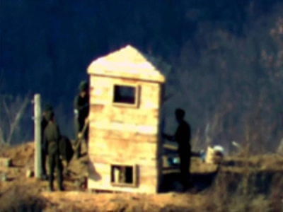 North Korean soldiers rebuild a guard post on the North side of the Demilitarized zone dividing the two Koreas in this undated handout photo released Monday.