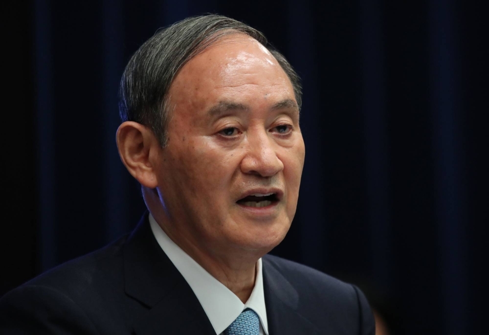 Former Prime Minister Yoshihide Suga says Japanese firms' clean energy technology can speed up the country’s efforts to curb emissions. 