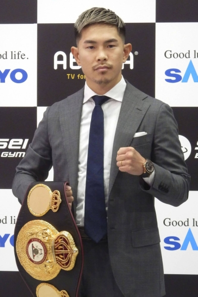 Kazuto Ioka poses during a news conference on Monday.