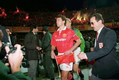 Bryan Robson leads the Manchester United team out for a UEFA Champions League fixture against Galatasaray at the Ali Sami Yen Stadium in Istanbul in November 1993.