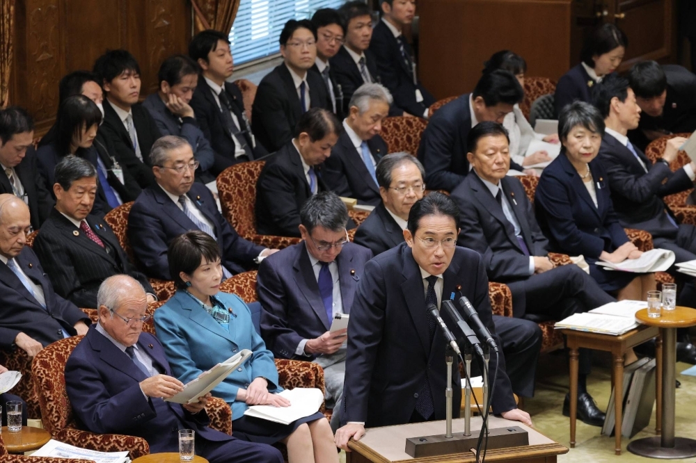 Prime Minister Fumio Kishida answers questions during an Upper House budget committee meeting on Monday.