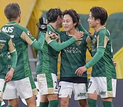 Koki Morita (second from right) celebrates with his Tokyo Verdy teammates after scoring against JEF United Chiba in their playoff semifinal for promotion to the J. League top flight, at Ajinomoto Stadium in Chofu, western Tokyo, on Sunday.