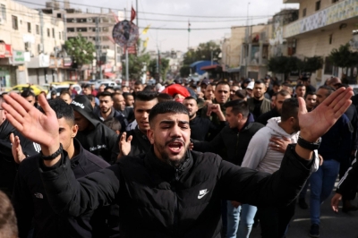 Mourners at a funeral on Nov. 19 carry the body of a Palestinian shot dead earlier during a raid by Israeli forces on a refugee camp near the occupied West Bank city of Bethlehem.