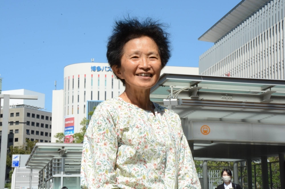 Yoko Huijs-Watanuki poses in the city of Fukuoka during a visit to Japan in October.