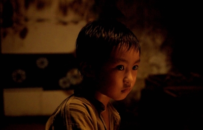A young boy (Tsukao Oga) struggles to survive in a war-ravaged city in “Shadow of Fire.”
